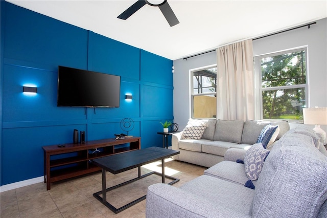 3181 Tocoa Cir, Kissimmee, FL 34746 - living area with a ceiling fan and a decorative wall