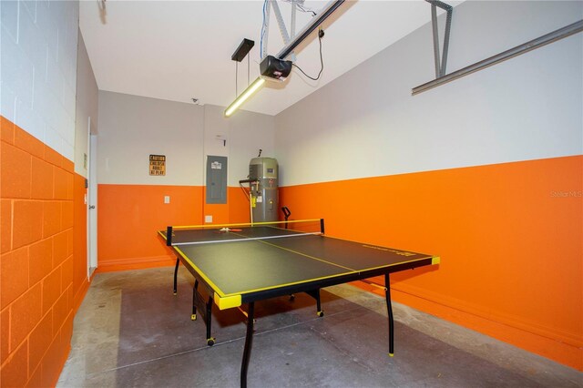 3181 Tocoa Cir, Kissimmee, FL 34746 - playroom with concrete flooring, electric panel, water heater, and concrete block wall