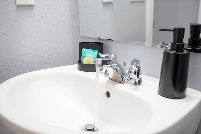3181 Tocoa Cir, Kissimmee, FL 34746 - bathroom view of a sink and a textured wall
