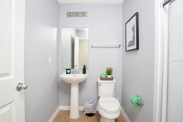 3181 Tocoa Cir, Kissimmee, FL 34746 - full bathroom with toilet, tile patterned flooring, baseboards, a sink, and a shower
