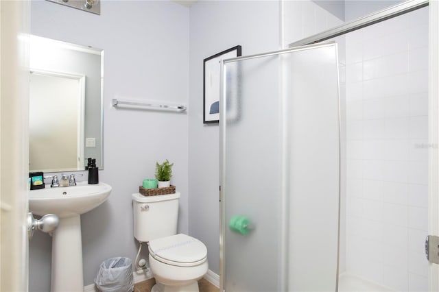 3181 Tocoa Cir, Kissimmee, FL 34746 - bathroom featuring a shower stall, toilet, and a sink