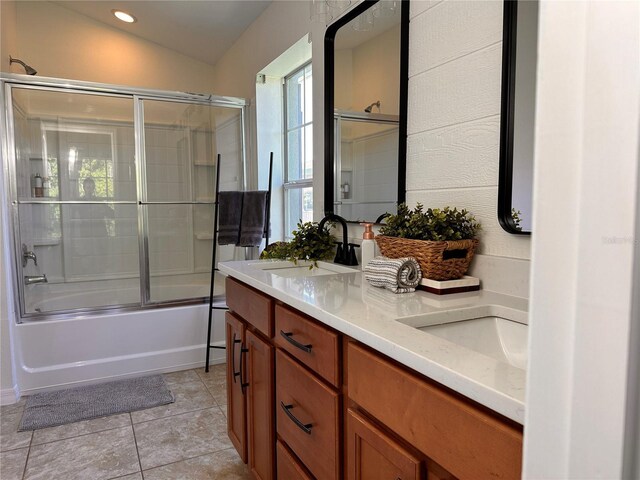 10734 Dawson Lily Way Unit S, Orlando, FL 32832 - bathroom with double vanity, tile patterned floors, combined bath / shower with glass door, and recessed lighting