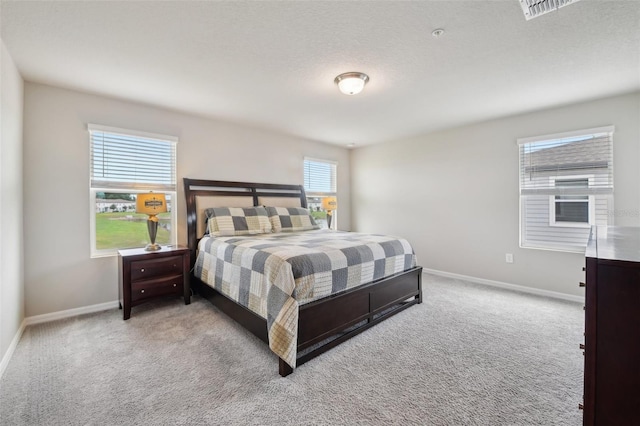 bedroom with carpet floors and baseboards