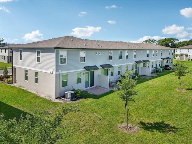 2462 Sweet Viburnum Way, Ocoee, FL 34761 - rear view of property with a lawn, a residential view, and central AC