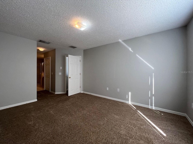 340 Cimarron Ct, Poinciana, FL 34759 - additional living space featuring a textured ceiling, dark colored carpet, and baseboards
