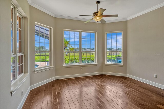 2350 Bradbury Rd, Haines City, FL 33844 - empty room featuring dark wood-style floors, baseboards, crown molding, and ceiling fan