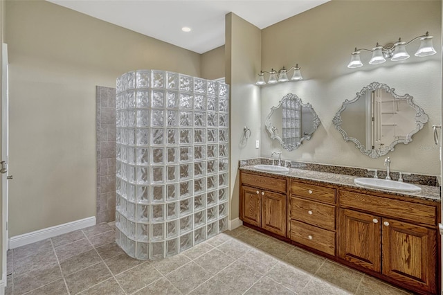 2350 Bradbury Rd, Haines City, FL 33844 - full bathroom with a walk in shower, double vanity, and baseboards