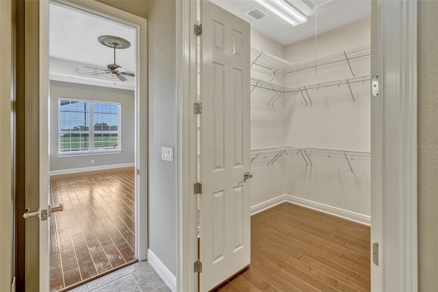 2350 Bradbury Rd, Haines City, FL 33844 - walk in closet featuring ceiling fan, wood finished floors, and attic access