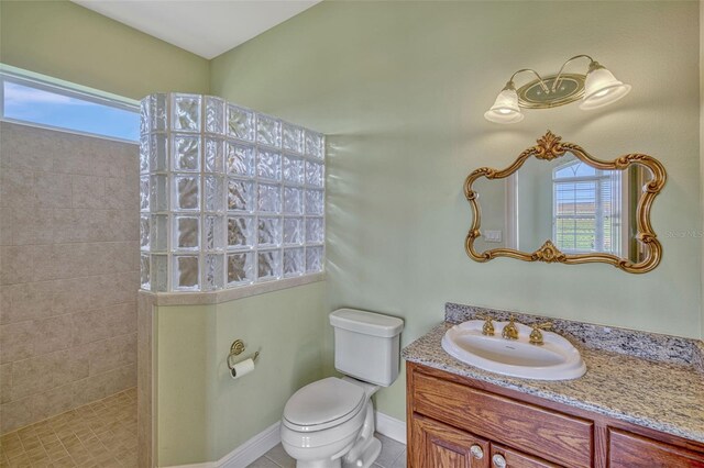 2350 Bradbury Rd, Haines City, FL 33844 - full bathroom with a walk in shower, toilet, healthy amount of natural light, and vanity