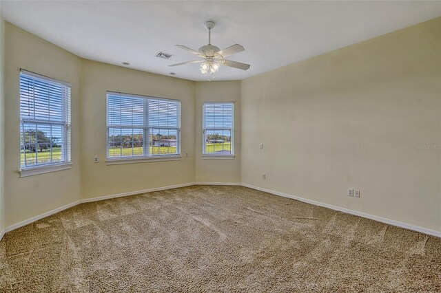 2350 Bradbury Rd, Haines City, FL 33844 - carpeted spare room with healthy amount of natural light, baseboards, and ceiling fan
