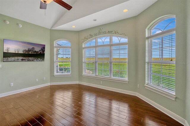 2350 Bradbury Rd, Haines City, FL 33844 - empty room with a ceiling fan, vaulted ceiling, dark wood-style flooring, baseboards, and a smoke detector