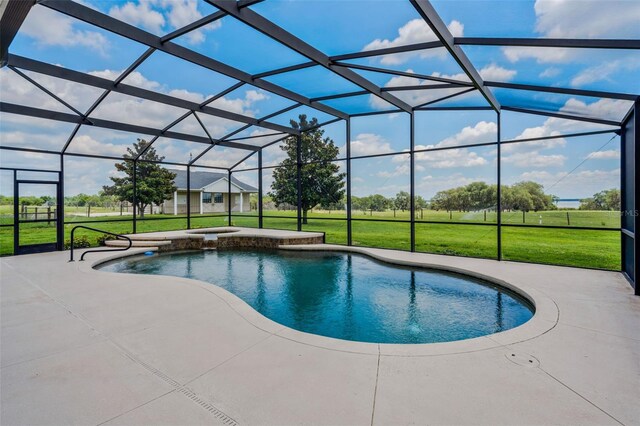 2350 Bradbury Rd, Haines City, FL 33844 - view of swimming pool featuring a lawn, a patio, a lanai, and a pool with connected hot tub