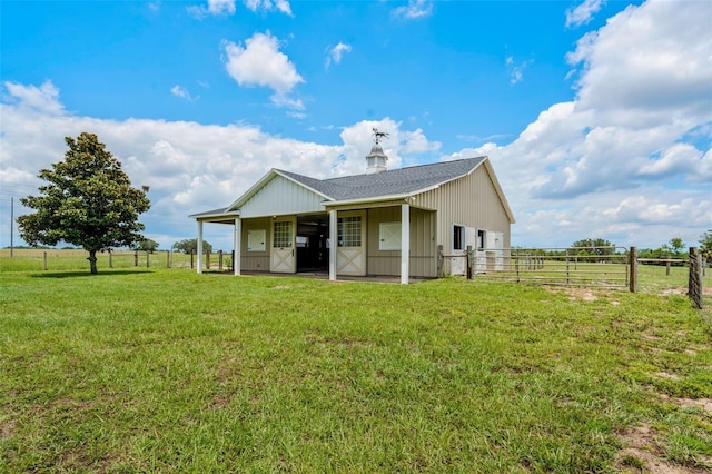 2350 Bradbury Rd, Haines City, FL 33844 - back of house with a shingled roof and a garage