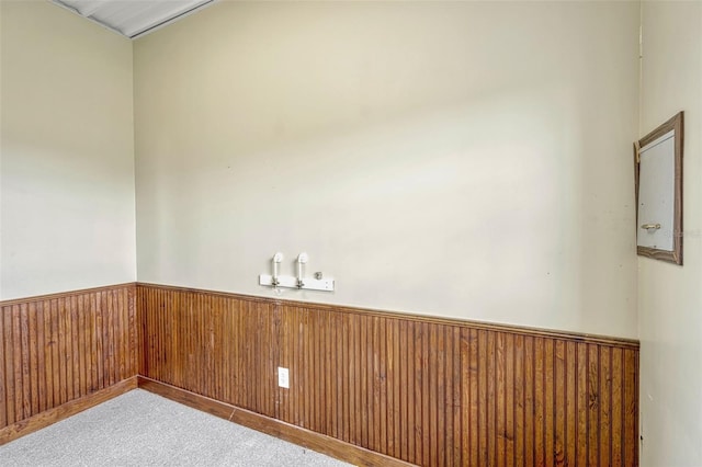 2350 Bradbury Rd, Haines City, FL 33844 - empty room with carpet floors, a wainscoted wall, and wood walls
