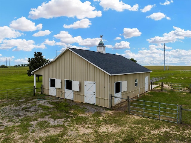2350 Bradbury Rd, Haines City, FL 33844 - view of barn with an exterior structure, a view of countryside, and a gate