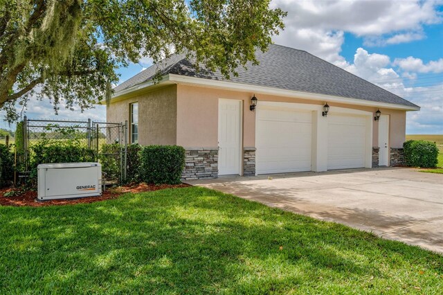 2350 Bradbury Rd, Haines City, FL 33844 - view of side of property with stone siding, stucco siding, and a garage