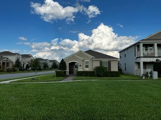 9318 Mclaren Aly, Winter Garden, FL 34787 - view of front facade featuring a front lawn and stucco siding