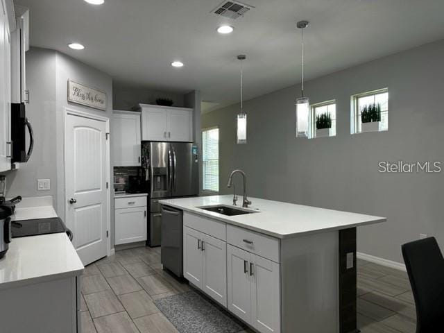 9318 Mclaren Aly, Winter Garden, FL 34787 - kitchen with dishwasher, a sink, light countertops, plenty of natural light, and recessed lighting