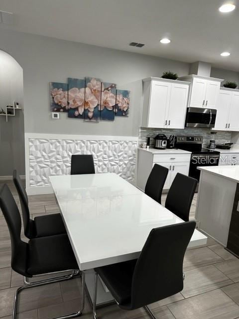 9318 Mclaren Aly, Winter Garden, FL 34787 - dining room with recessed lighting and arched walkways