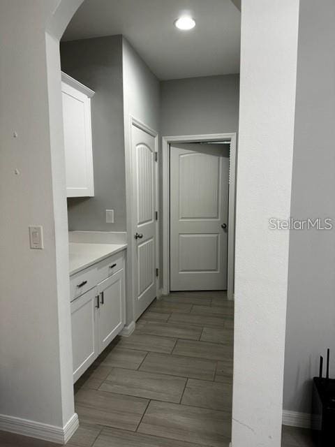 9318 Mclaren Aly, Winter Garden, FL 34787 - corridor with arched walkways and baseboards