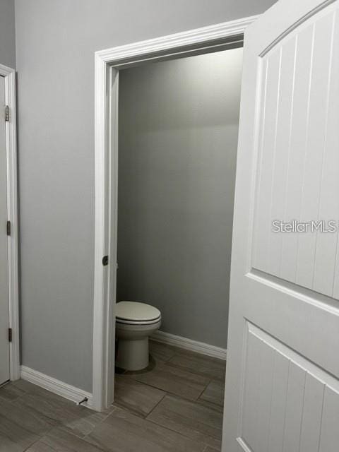 9318 Mclaren Aly, Winter Garden, FL 34787 - bathroom with baseboards and toilet