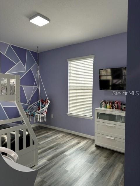 9318 Mclaren Aly, Winter Garden, FL 34787 - game room with wood finished floors and baseboards