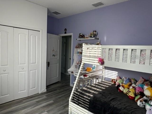 9318 Mclaren Aly, Winter Garden, FL 34787 - bedroom featuring a closet and wood finished floors