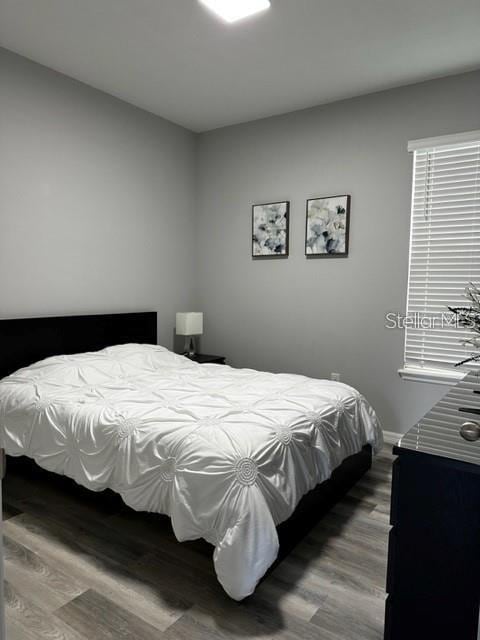 9318 Mclaren Aly, Winter Garden, FL 34787 - bedroom with wood finished floors and baseboards