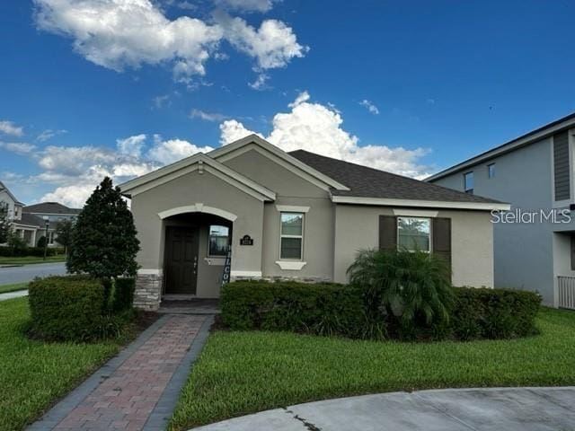 9318 Mclaren Aly, Winter Garden, FL 34787 - ranch-style house featuring stucco siding and a front yard