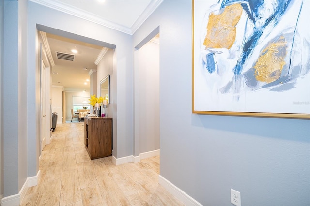 hall featuring crown molding, light wood finished floors, baseboards, and recessed lighting