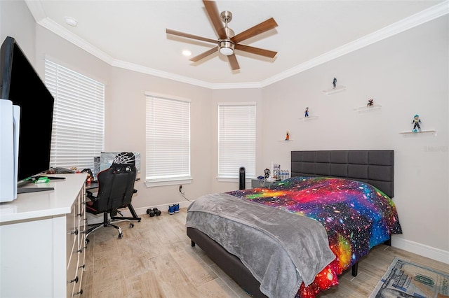 bedroom featuring light wood-type flooring, baseboards, crown molding, an office area, and ceiling fan