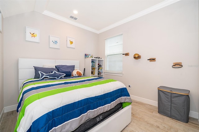 bedroom featuring wood finished floors, baseboards, and ornamental molding