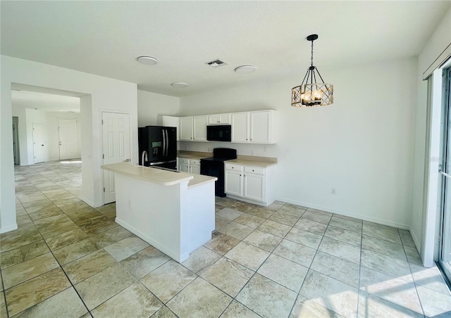 kitchen with black appliances, white cabinetry, light countertops, decorative light fixtures, and a chandelier