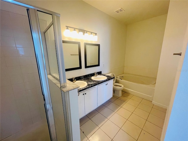 bathroom featuring tile patterned floors, a shower stall, a garden tub, and double vanity