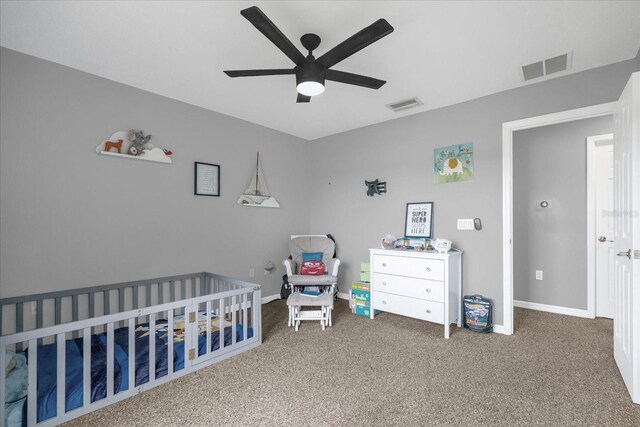 4981 Alita Ter, Saint Cloud, FL 34769 - bedroom featuring a crib, carpet flooring, baseboards, and ceiling fan