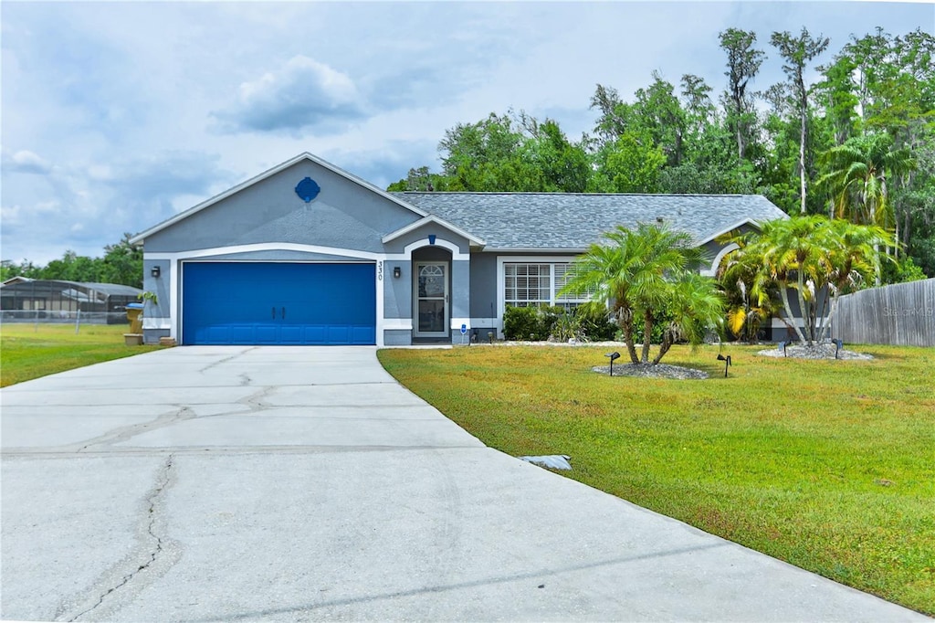 330 Chiquita Ct, Kissimmee, FL 34758 - ranch-style house with concrete driveway, an attached garage, and stucco siding
