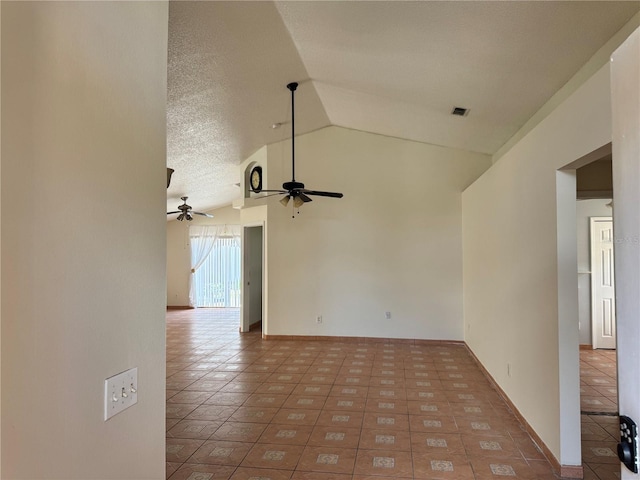 tiled spare room featuring lofted ceiling and ceiling fan