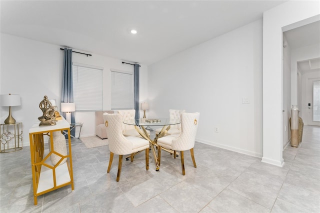 dining space with baseboards and recessed lighting