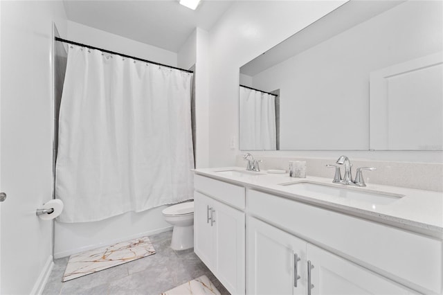 full bath with double vanity, toilet, marble finish floors, baseboards, and shower / tub combo with curtain