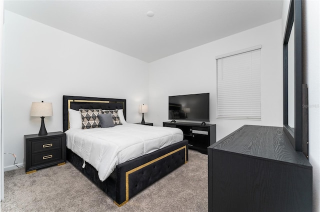 bedroom featuring light colored carpet
