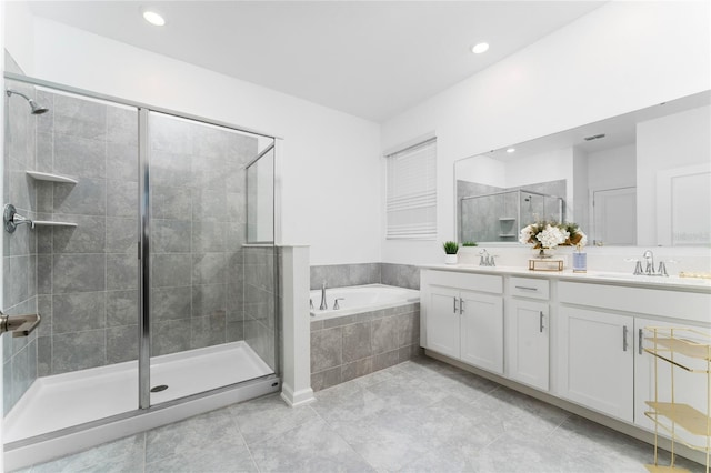 full bath featuring a stall shower, a bath, double vanity, tile patterned floors, and recessed lighting