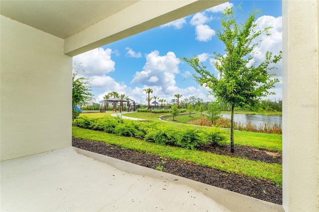 view of patio with a water view