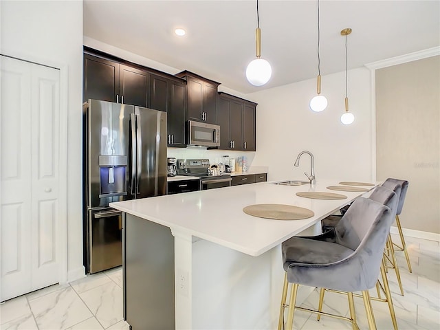 2970 Protagonist St, Kissimmee, FL 34746 - kitchen featuring stainless steel appliances, a sink, light marble finish floors, a breakfast bar, and a kitchen island with sink