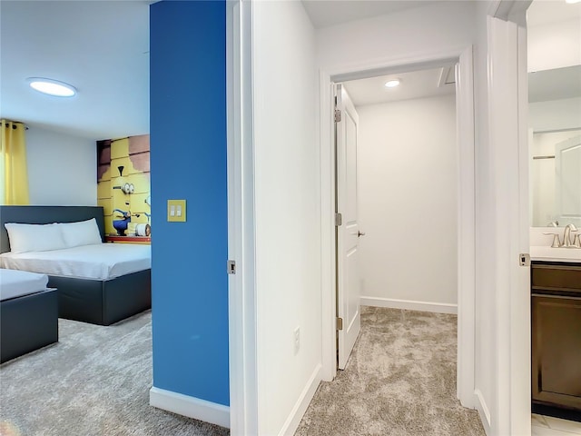 2970 Protagonist St, Kissimmee, FL 34746 - bedroom featuring light colored carpet, baseboards, a sink, and recessed lighting