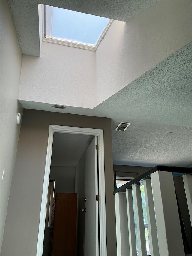 940 Fenton Ln Unit 8, Lakeland, FL 33809 - staircase featuring a textured ceiling and healthy amount of natural light