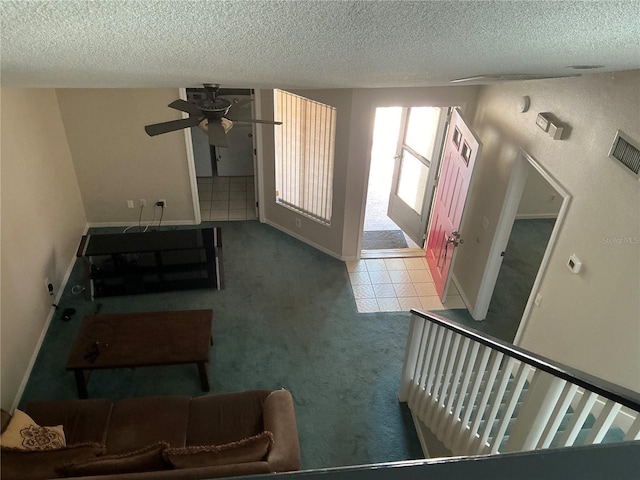 940 Fenton Ln Unit 8, Lakeland, FL 33809 - living room with a textured ceiling, carpet, a ceiling fan, and baseboards