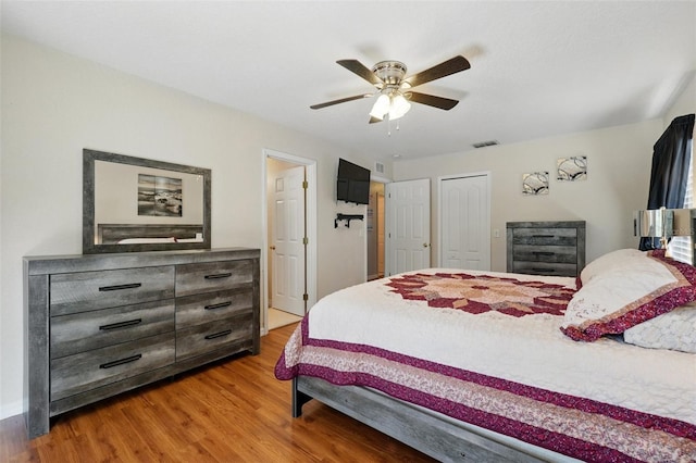 203 La Mirage St, Davenport, FL 33897 - bedroom with wood finished floors, ceiling fan, and a closet