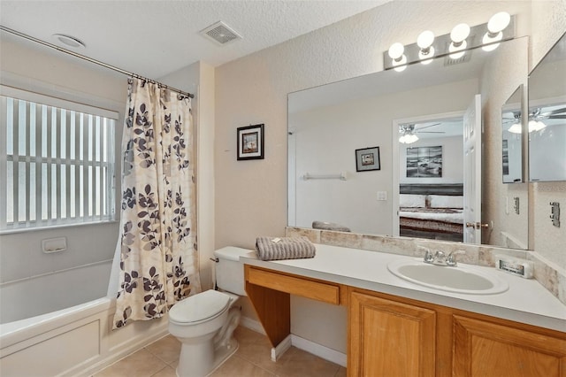 203 La Mirage St, Davenport, FL 33897 - bathroom with a ceiling fan, toilet, tile patterned floors, vanity, and shower / bath combo with shower curtain
