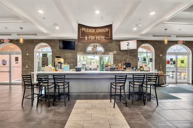 203 La Mirage St, Davenport, FL 33897 - indoor dry bar featuring healthy amount of natural light, tile patterned flooring, and decorative light fixtures