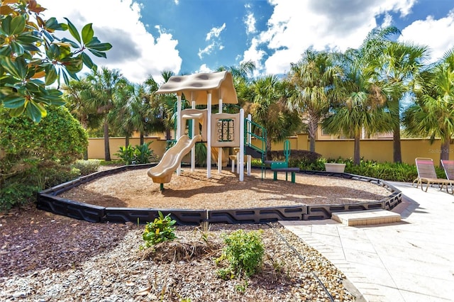 203 La Mirage St, Davenport, FL 33897 - communal playground featuring fence